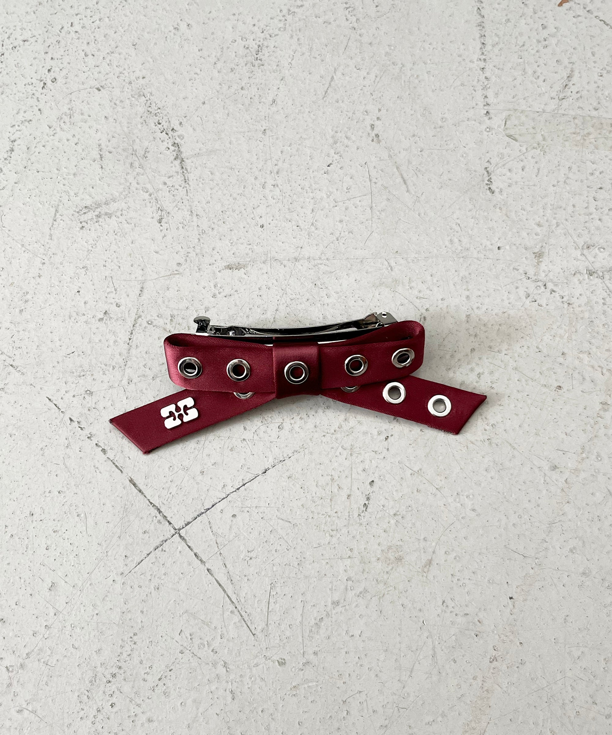 GANNI Eyelet bow barrette satin "BLACK"