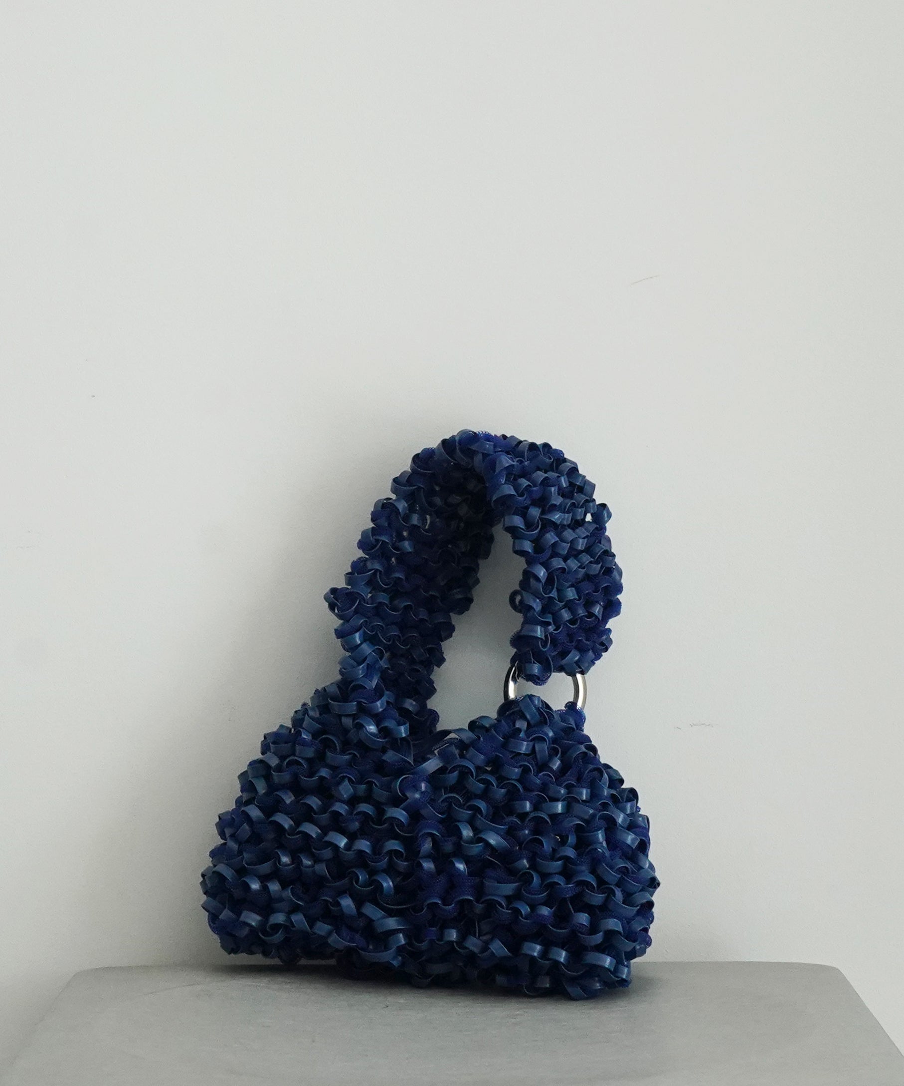 PROTCOL 'Grumo' tapeyarn hand bag "SILVER"