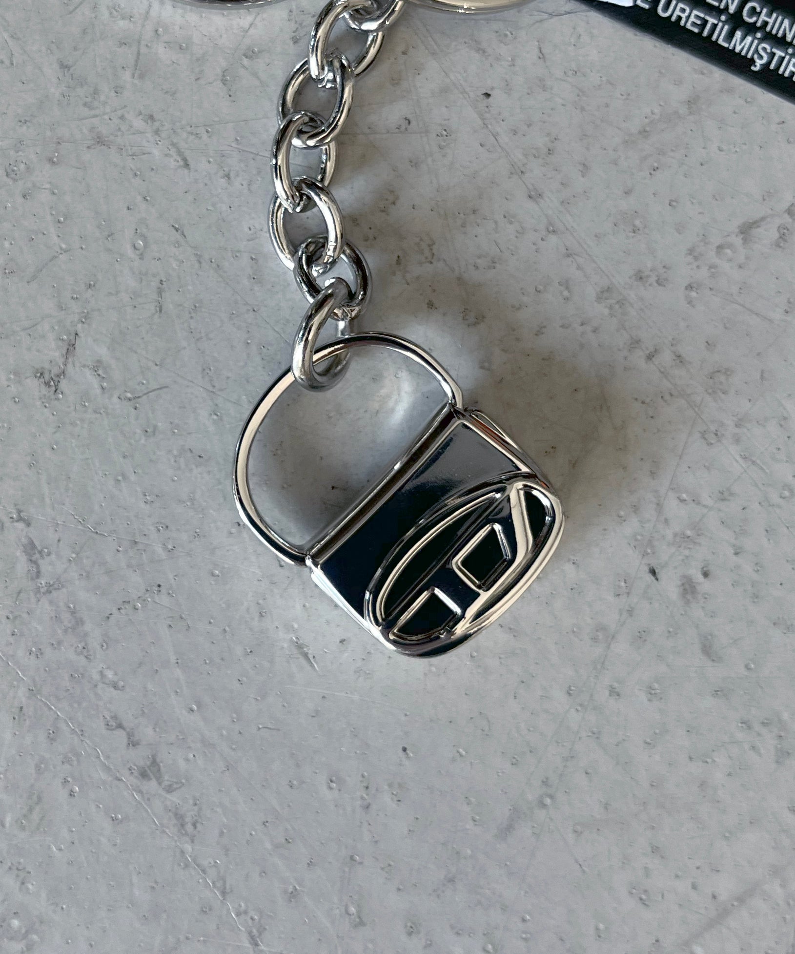 DIESEL Metal keyring with 1DR bag charm "SILVER"