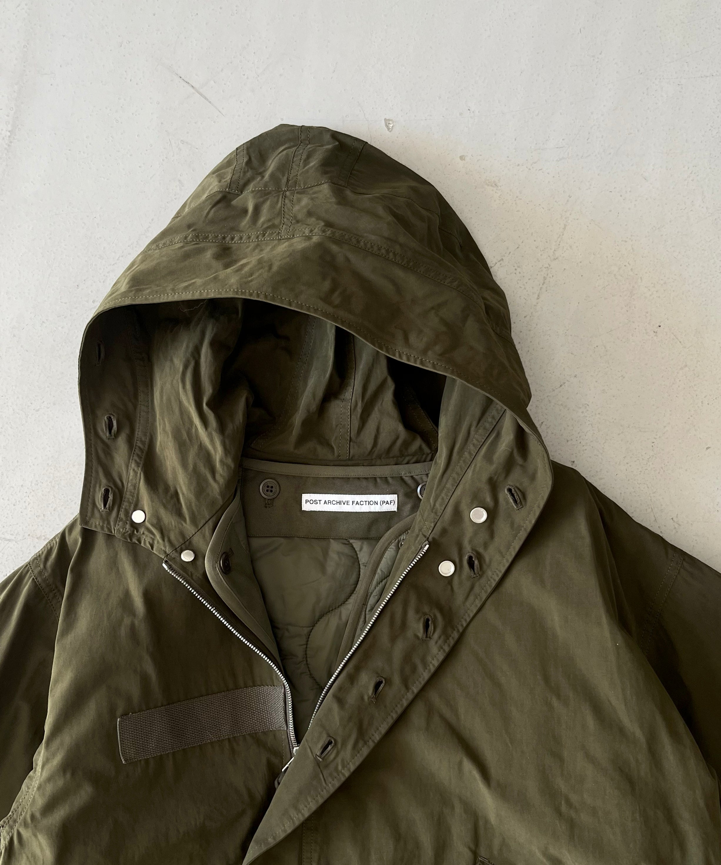 POST ARCHIVE FACTION(PAF) M66 parka "OLIVE GREEN"
