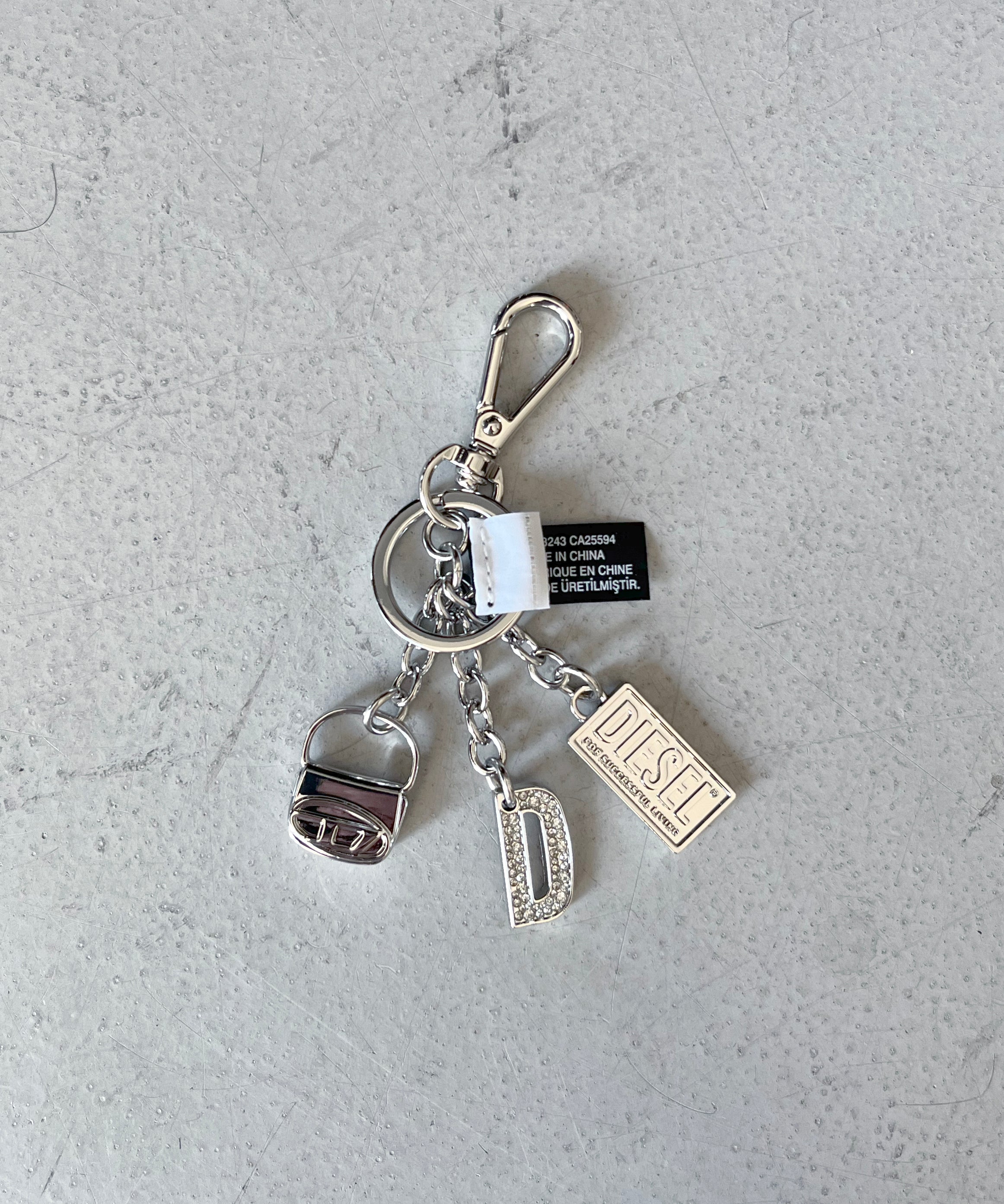 DIESEL 1DR KEY MULTICHARM "SILVER"