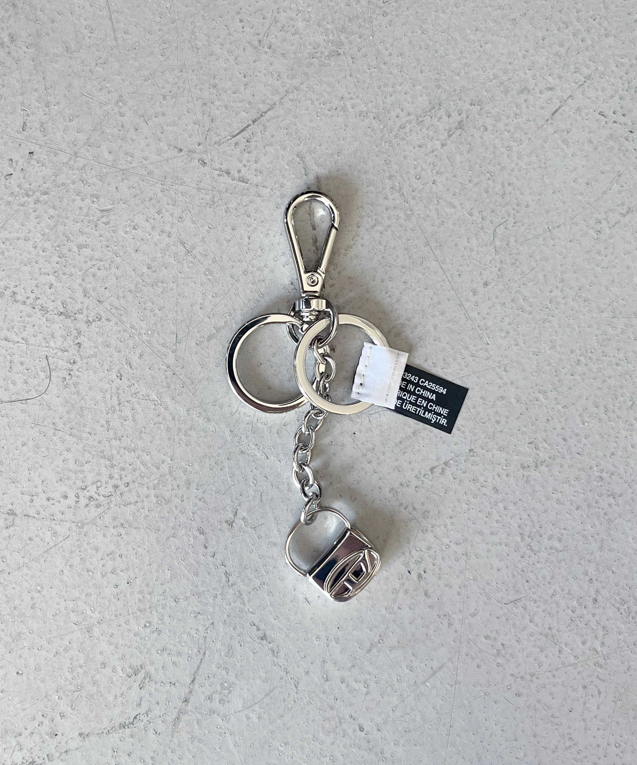 DIESEL Metal keyring with 1DR bag charm "SILVER"