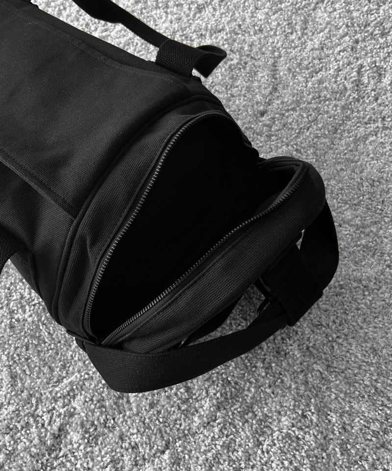 FRED PERRY Craig green barrel bag “BLACK”