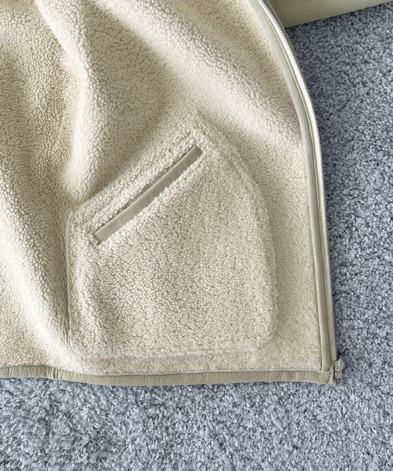 AURALEE Merino mouton zip blouson “IVORY LIME”