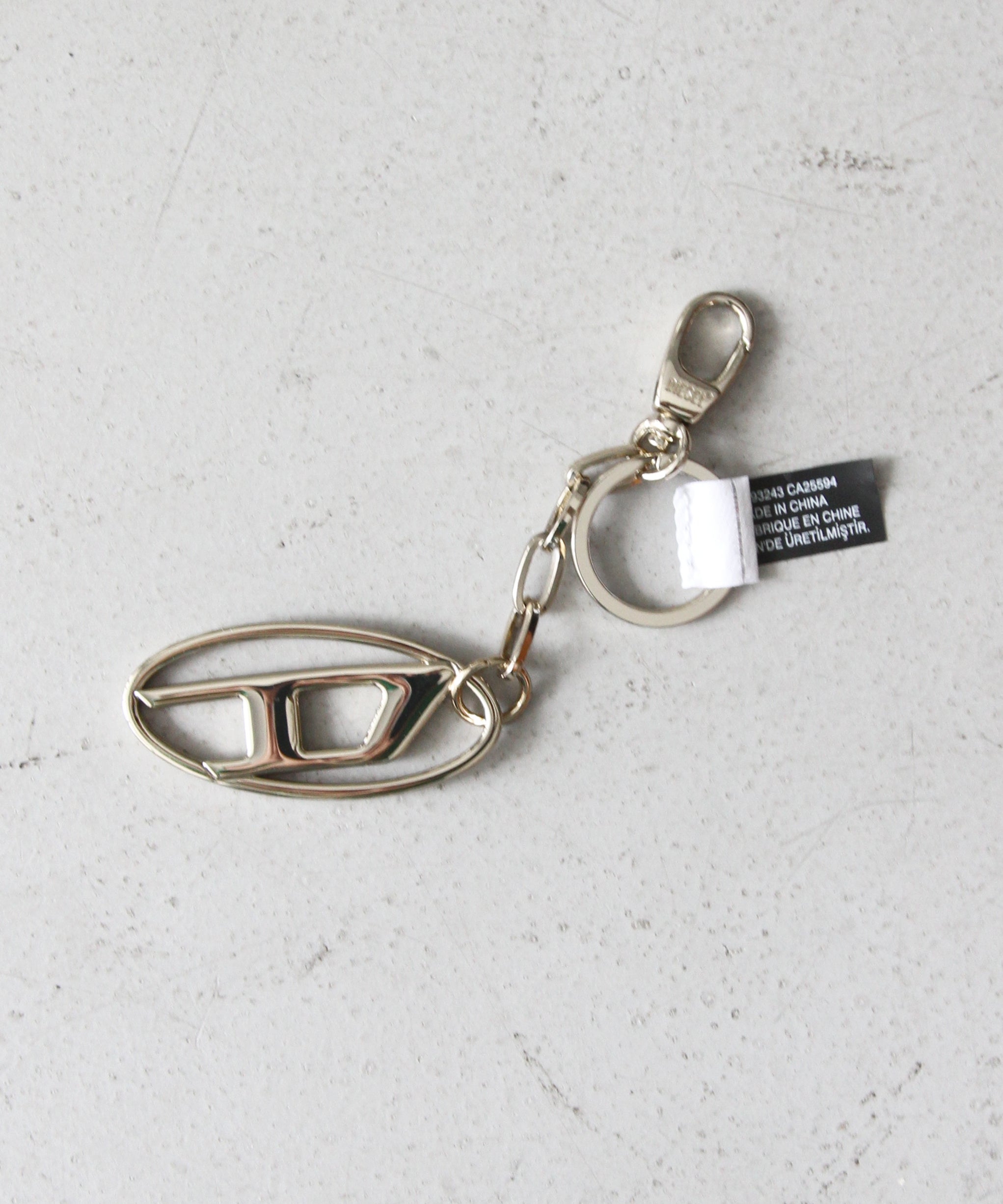 DIESEL Metal keyring with logo plaque "GOLD"