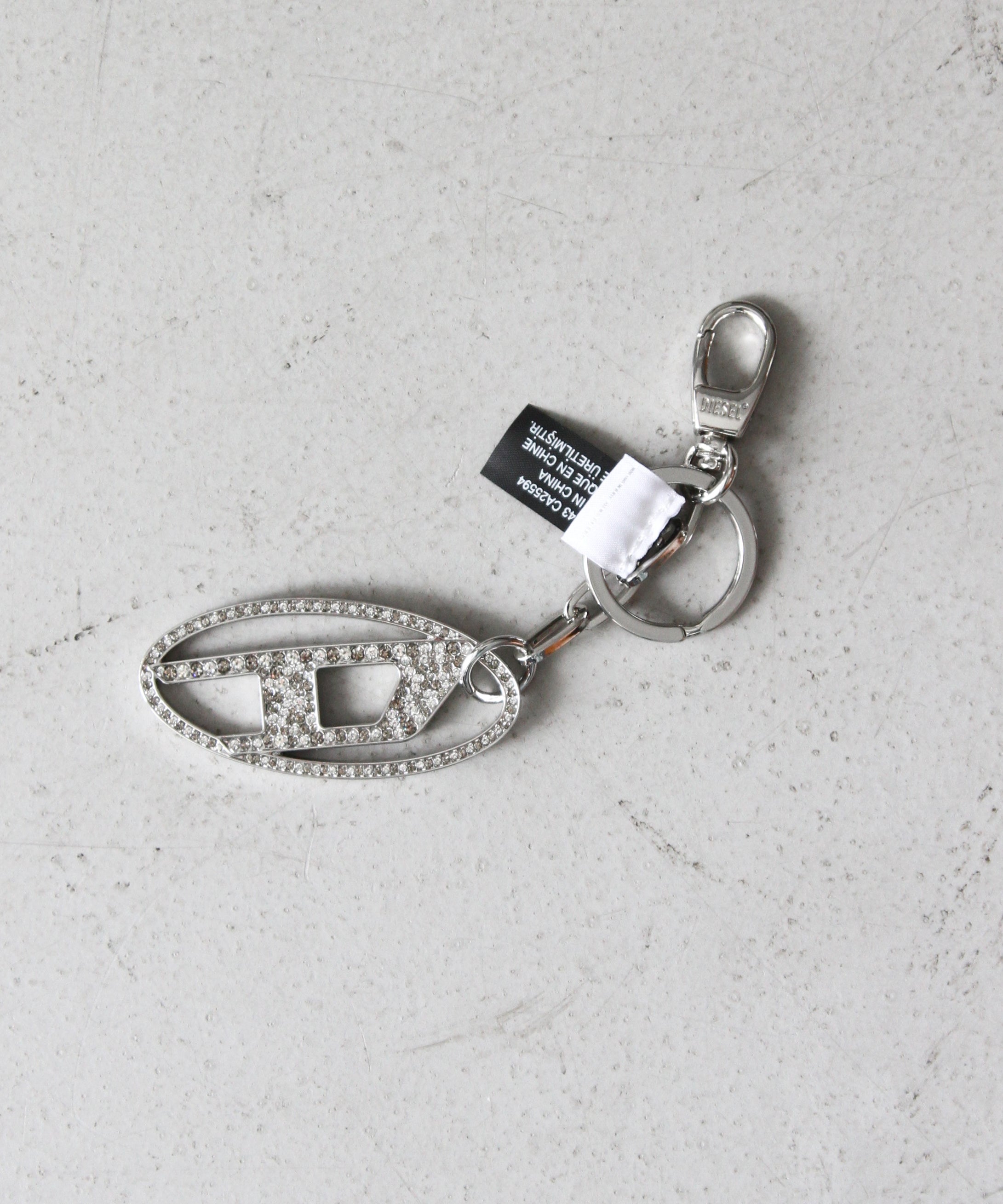 DIESEL Metal oval D keyring with crystal "CRYSTAL"