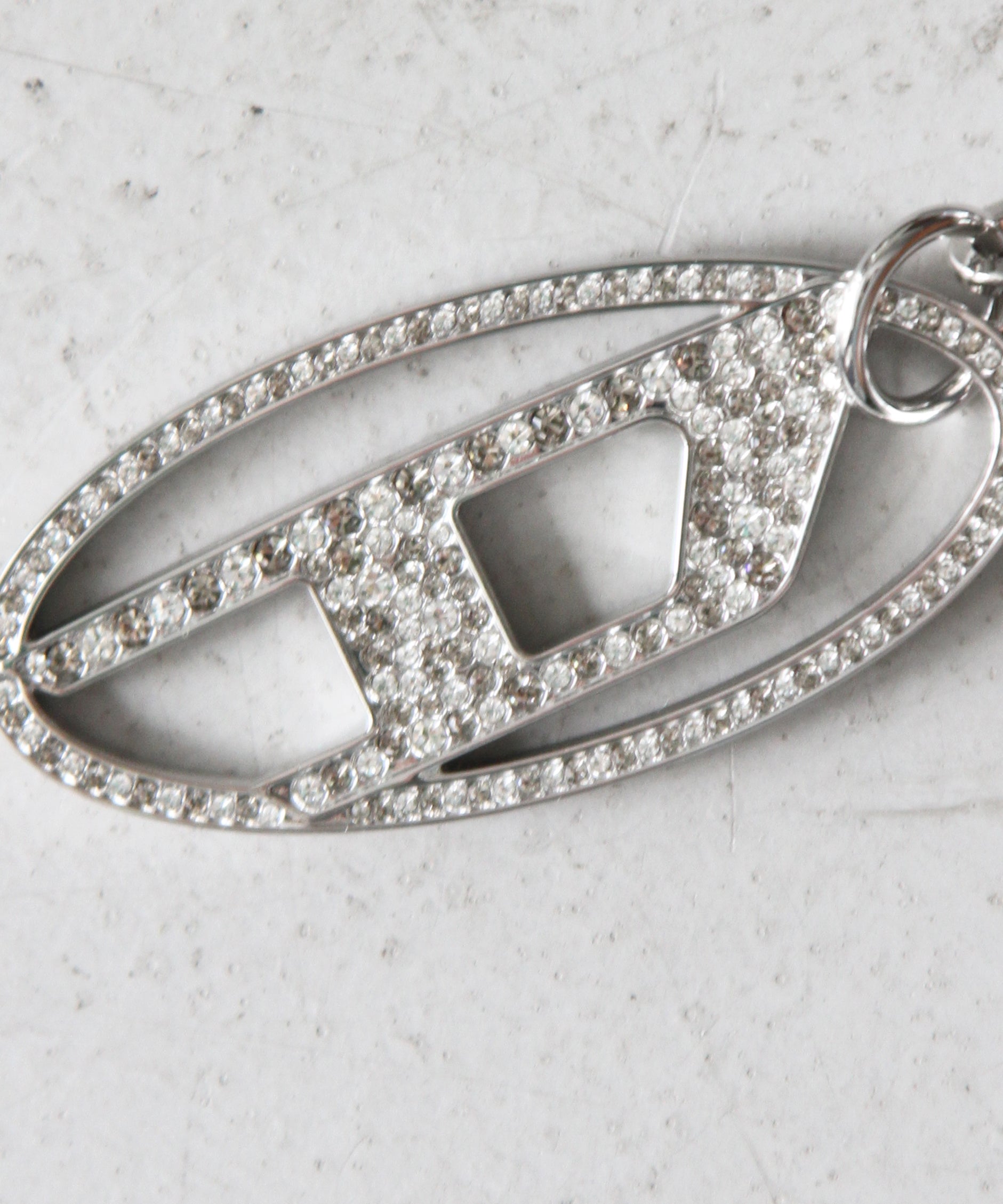 DIESEL Metal oval D keyring with crystal "CRYSTAL"